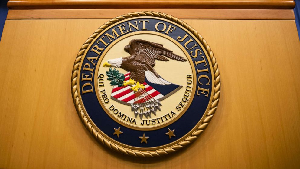 The seal of the U.S. Department of Justice displayed at a DOJ facility.