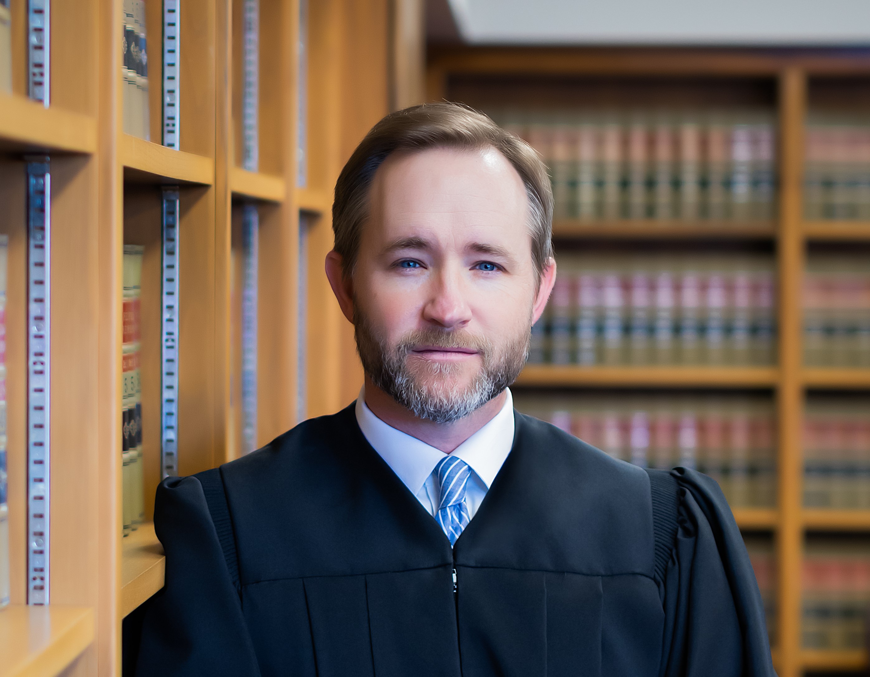 U.S. District Judge James Hendrix, shown in an official portrait or in a public setting outside a federal courthouse