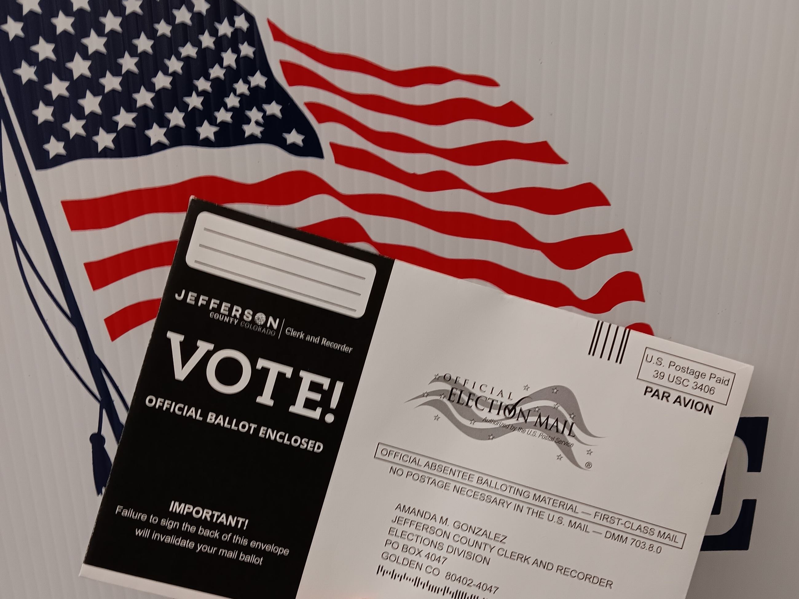 USPS Election Mail signage or a poster displayed at a post office, reflecting USPS guidance for election mail.