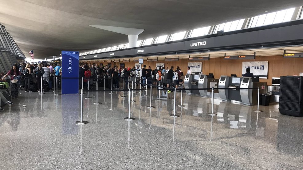 United Airlines check-in counters and signage inside Washington Dulles International Airport (IAD).
