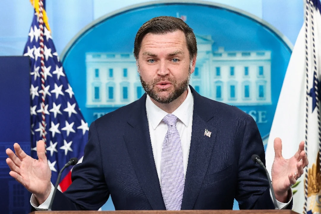 Vice President JD Vance speaking at a White House press briefing podium, news photography style