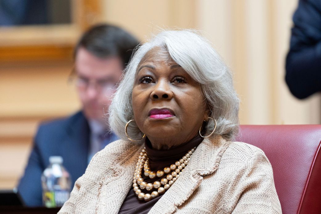 Virginia state Sen. L. Louise Lucas speaking at a public event, photographed at a lectern in a candid news-style image
