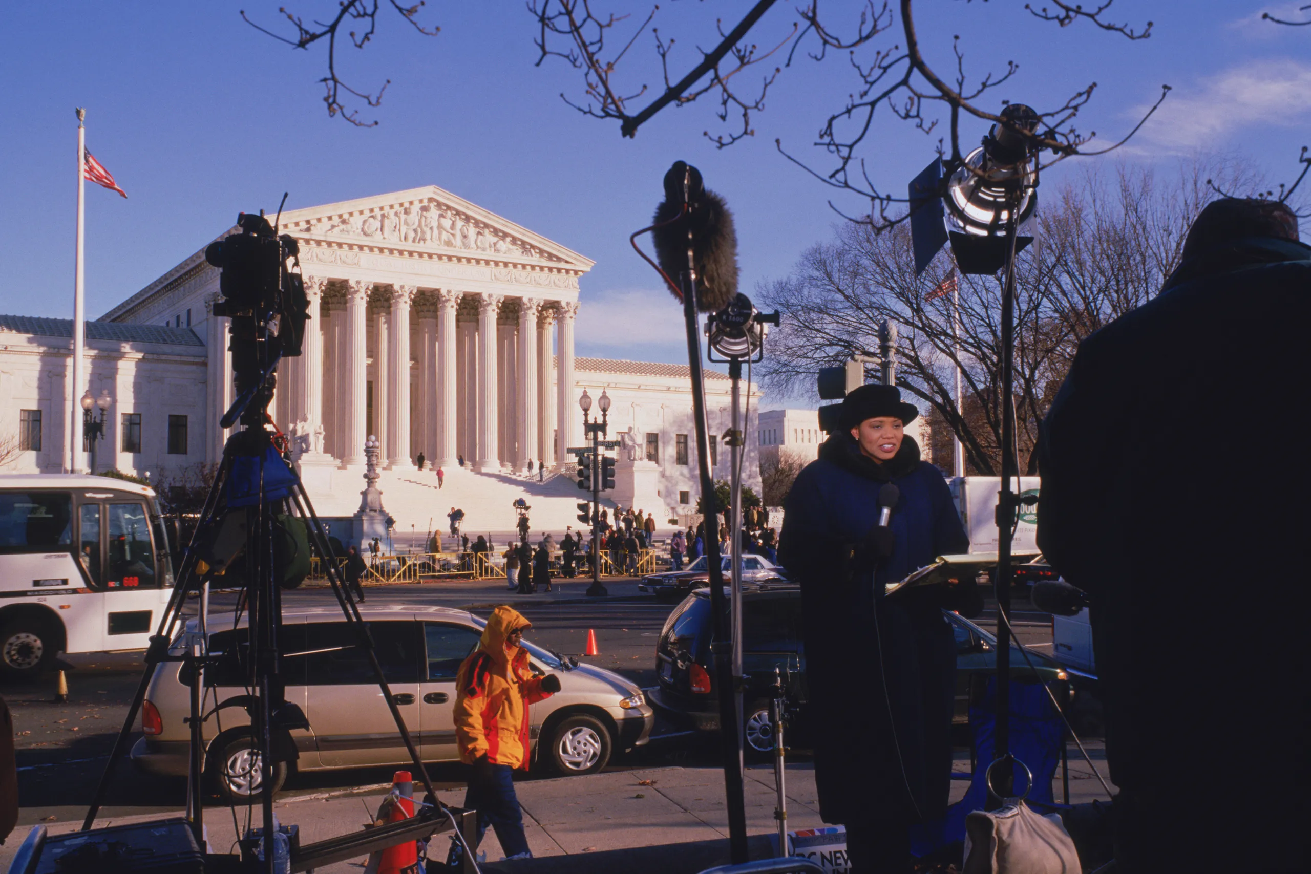 Visitors and reporters outside the U.S. Supreme Court on its front steps