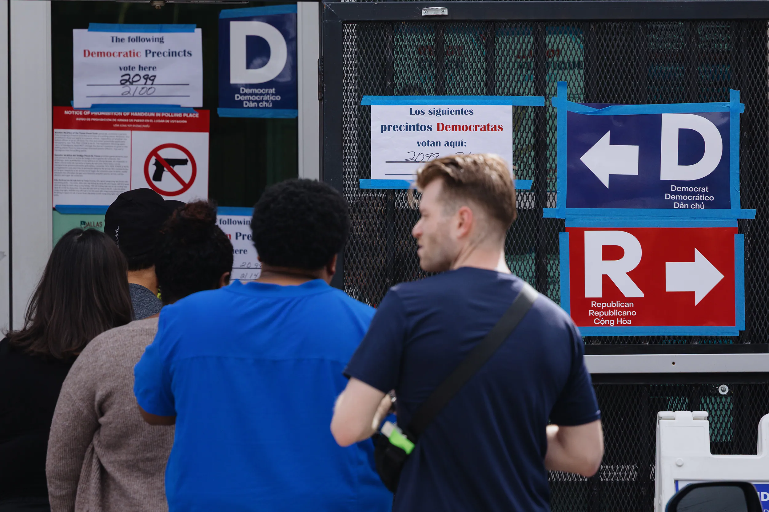 Voters waiting in line outside a New York City polling place during a primary election as poll workers check in voters at the entrance