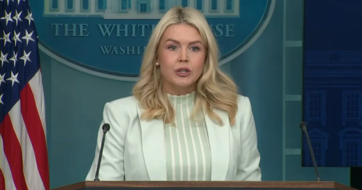 White House press briefing room with podium and seats, documentary news photograph