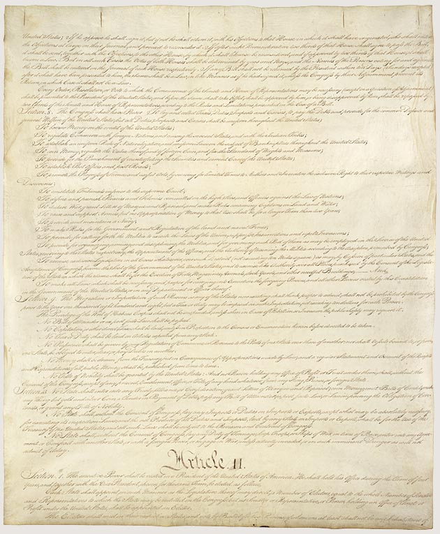 An open copy of the U.S. Constitution, focusing on Article II