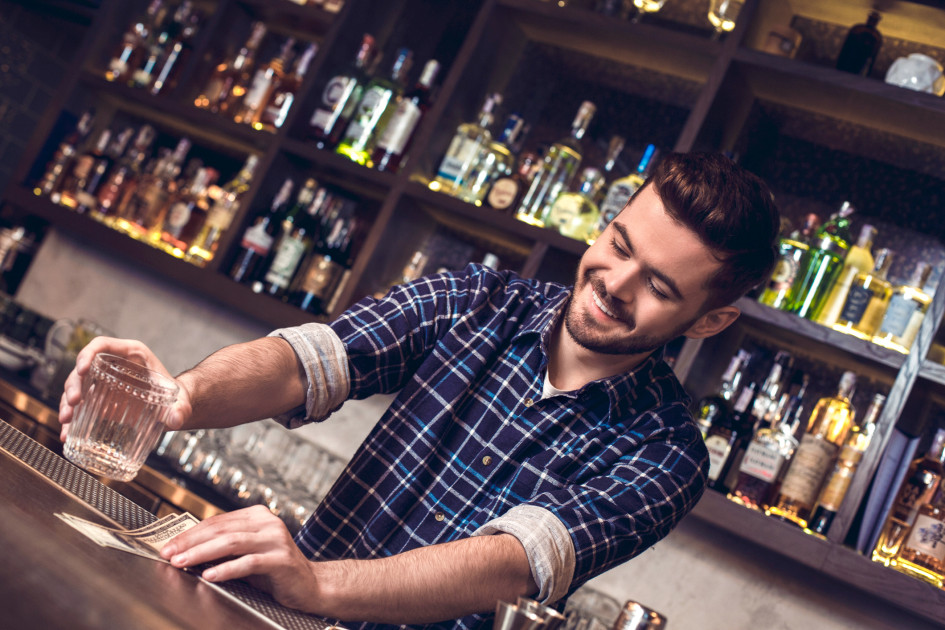 Bartender receiving cash tips