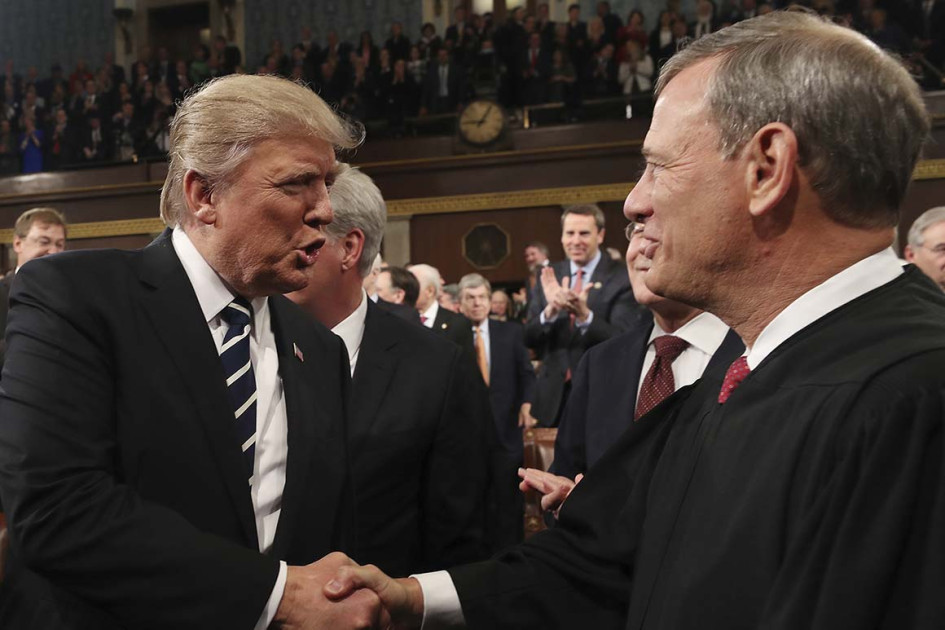 Chief Justice John Roberts greeting President Trump