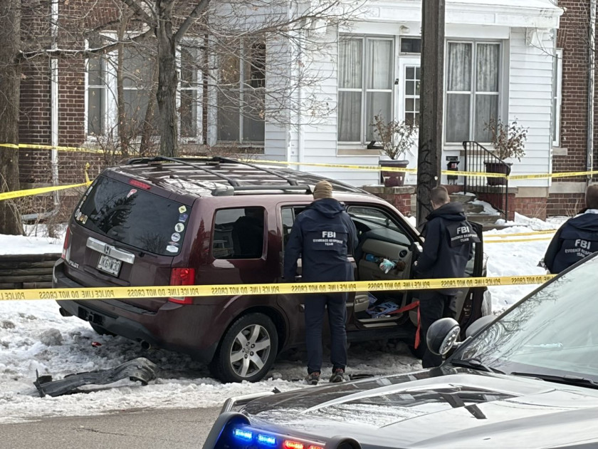 damaged federal enforcement vehicle with crime scene investigation markers