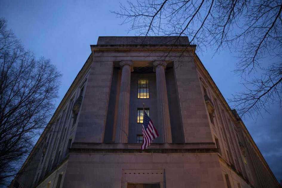 Department of Justice building exterior at dusk