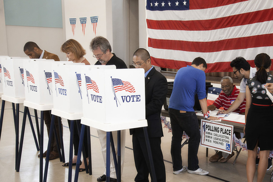 diverse voters at polling place
