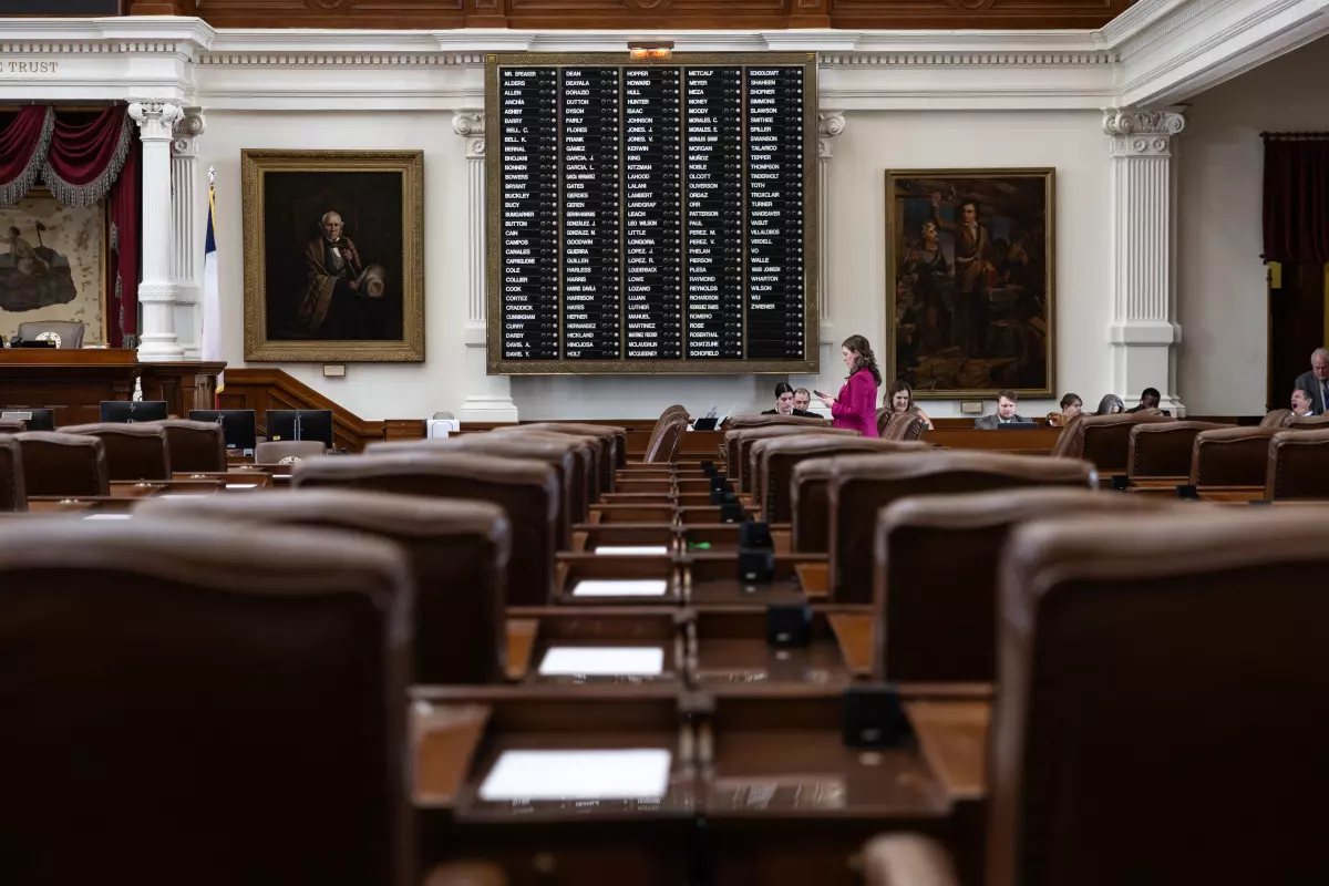 Empty chairs in the House of Representatives chamber