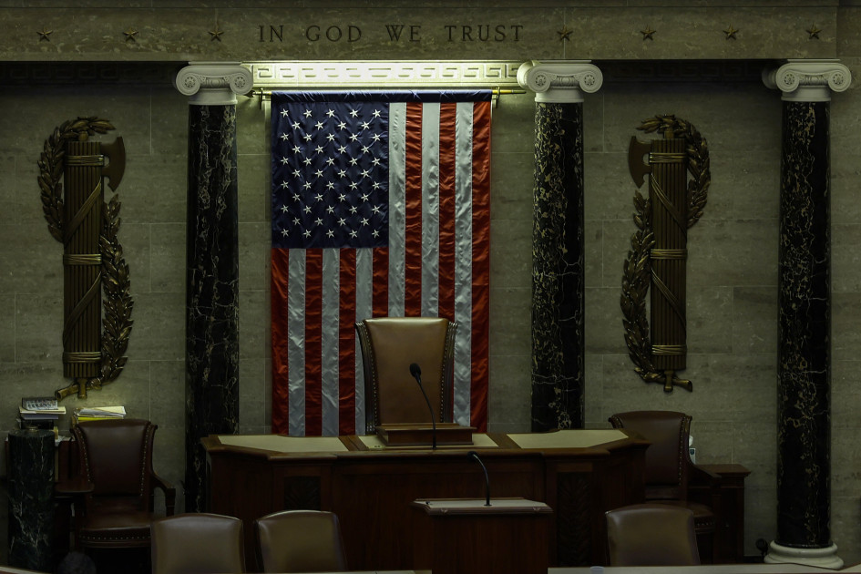 empty congressional chamber with American flag