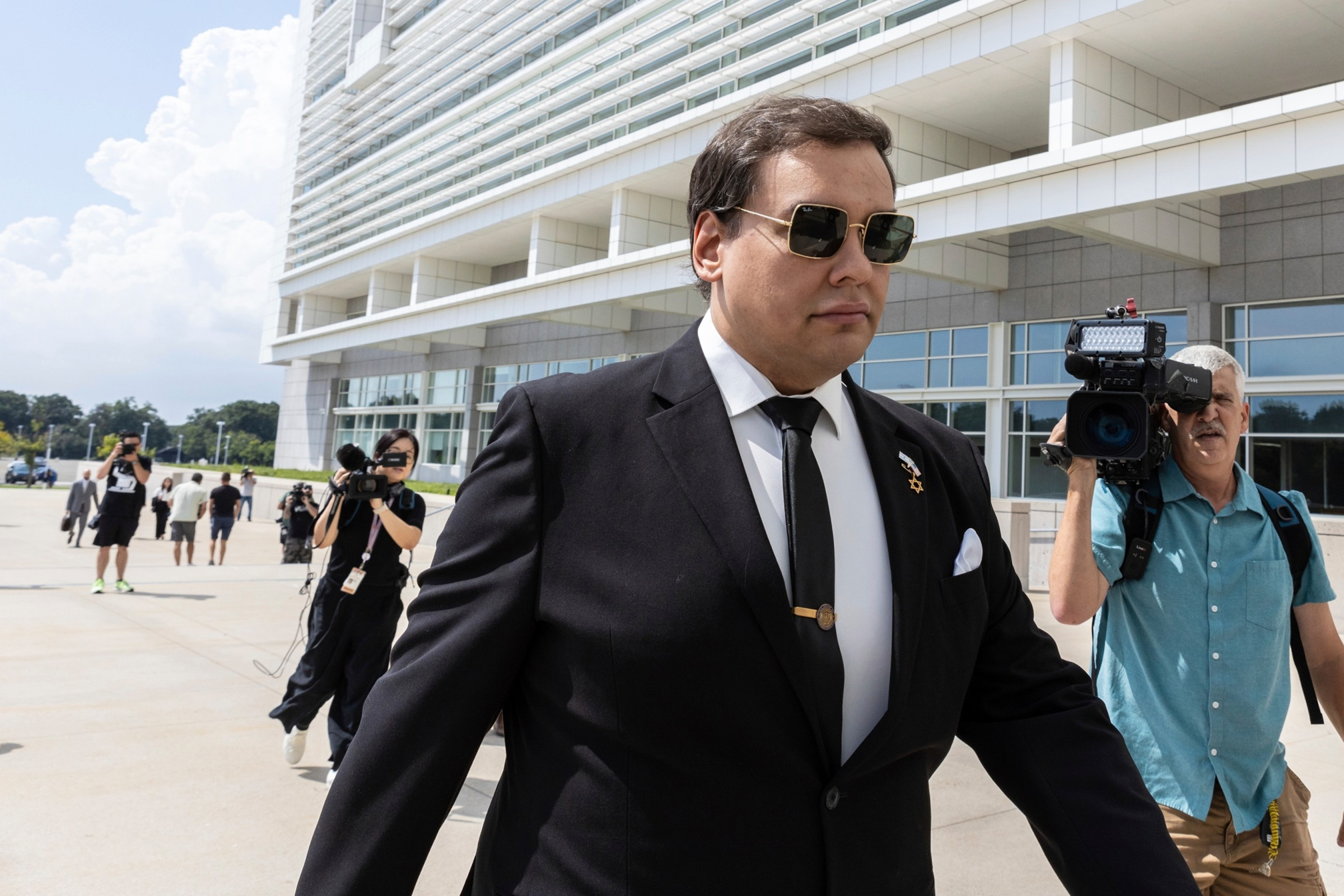 George Santos arriving at a federal courthouse
