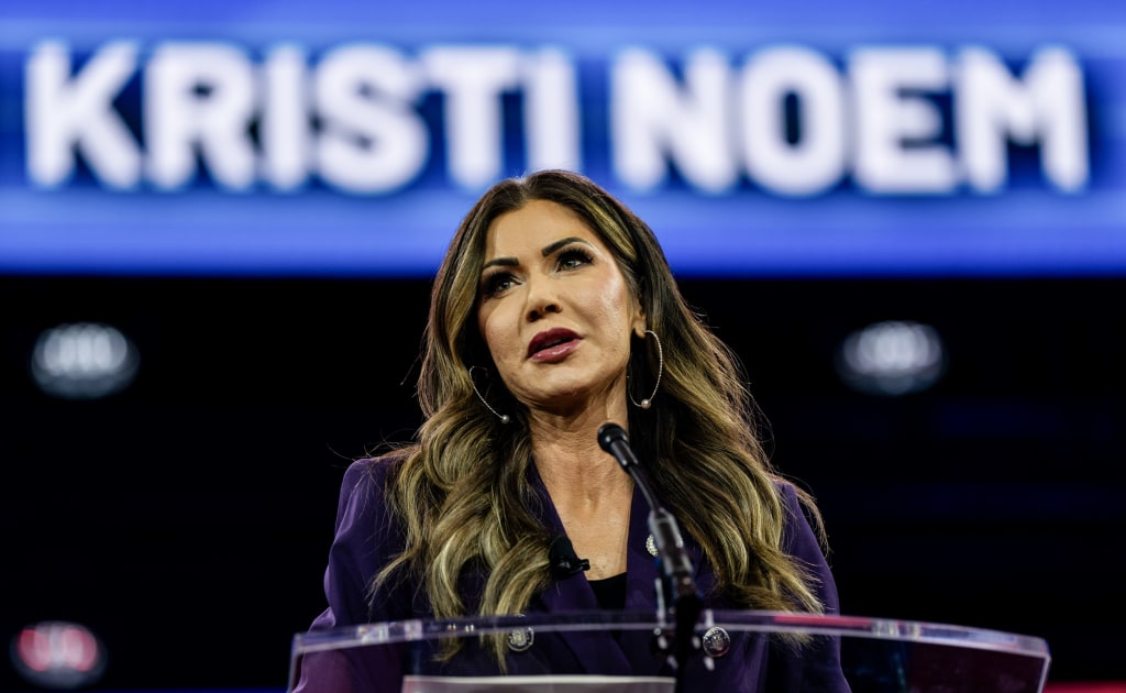 kristi noem talking confidently to reporters