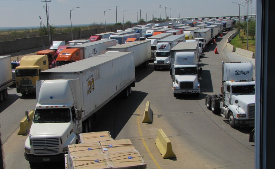 long line of trucks on a highway