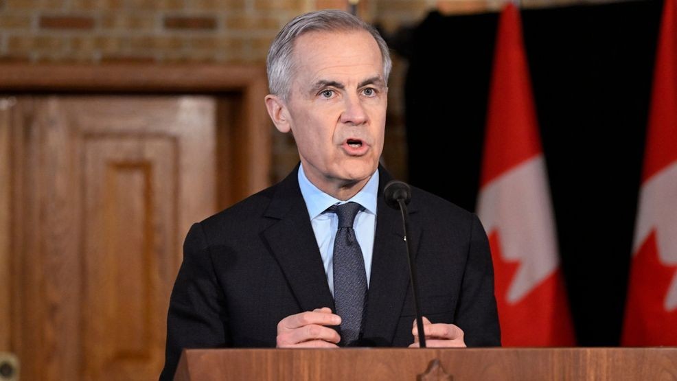 Mark Carney speaking at Davos podium with Trump's rescission letter