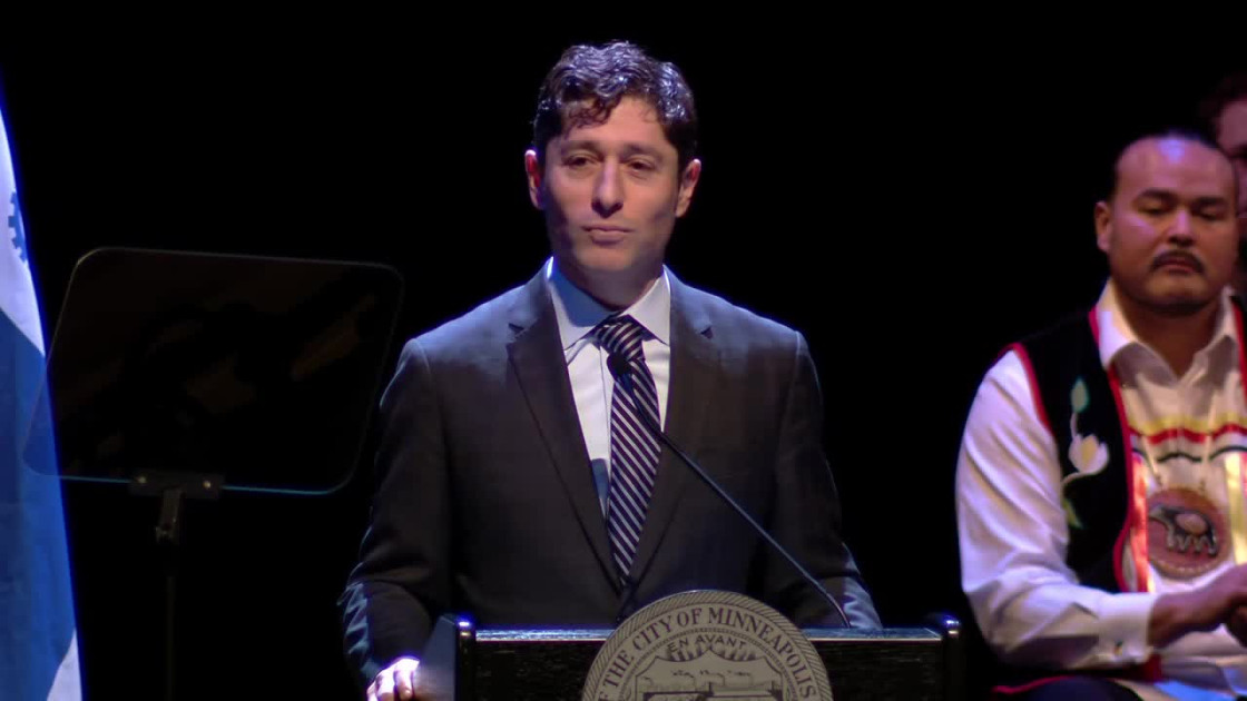 Minneapolis Mayor Jacob Frey at a podium with city officials