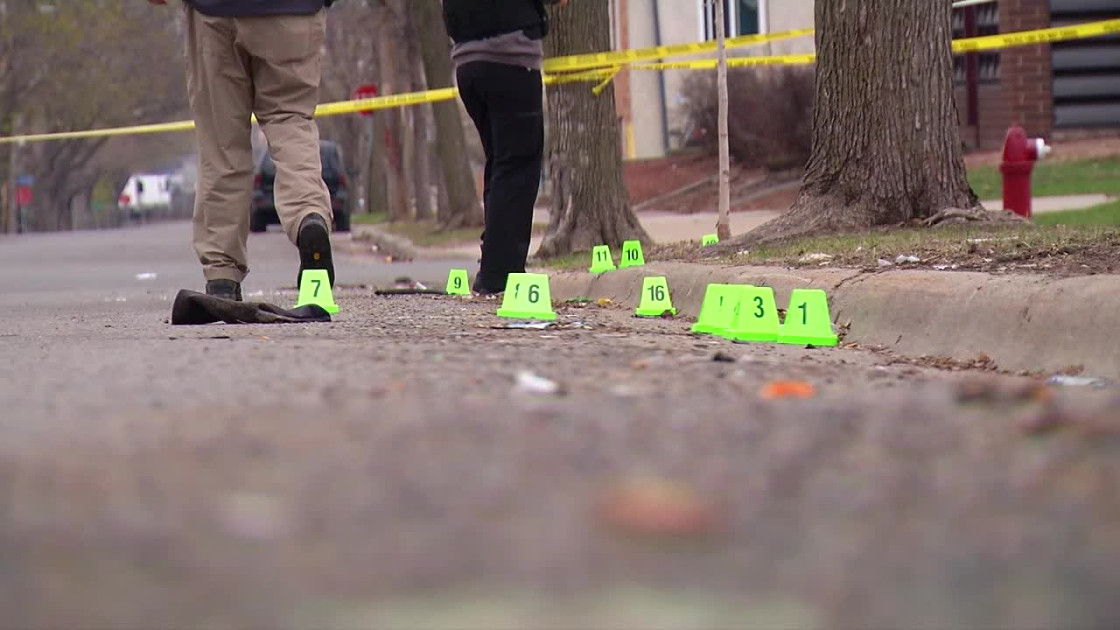 Minneapolis street scene with police tape and evidence markers