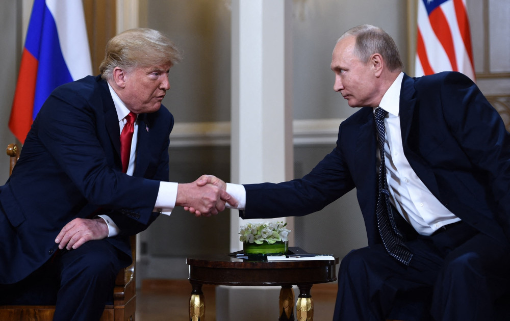 President Donald Trump and Russian President Vladimir Putin shaking hands