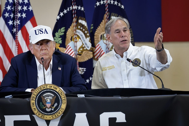 President Donald Trump (left) and Texas Gov. Greg Abbott participate in a round table event on July 11, 2025, in Kerrville, Texas. | Chip Somodevilla/Getty Images