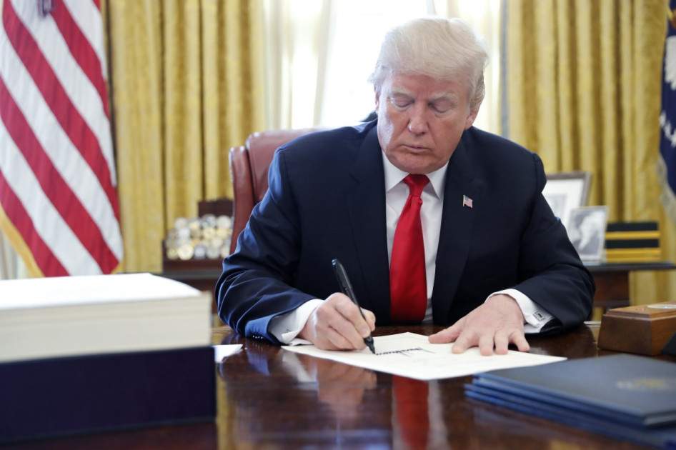 President Donald Trump signing legislation