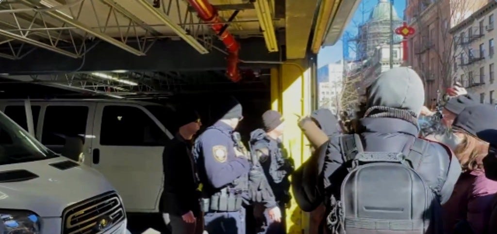 protesters blocking an ICE van in New York City