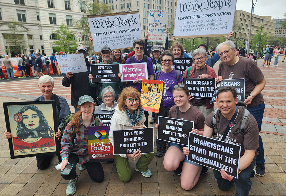 Protesters with signs at a rally in Washington DC