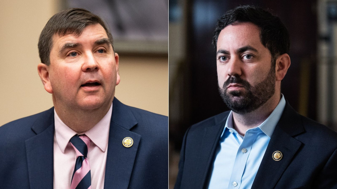 Rep. Mike Lawler signing documents on the House floor