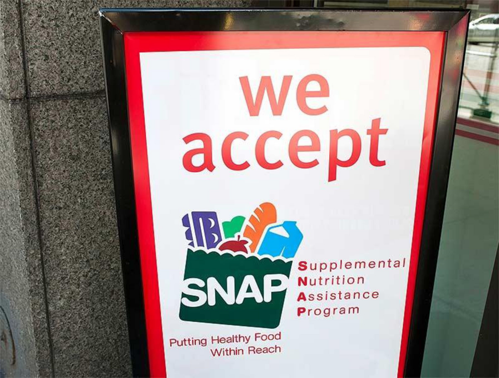 shop front sign showing the acceptance of SNAP food stamps