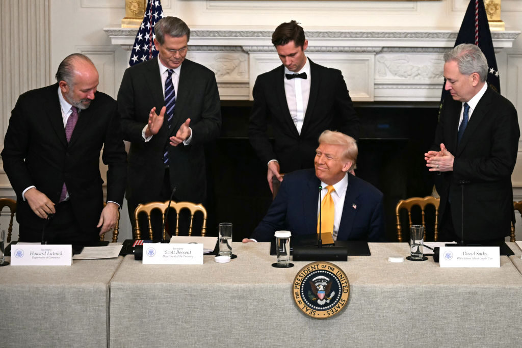 Trump at White House podium with Commerce Secretary Howard Lutnick
