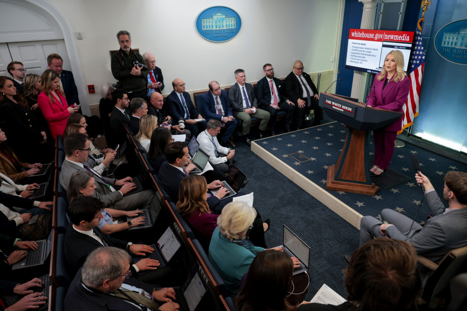 White House briefing room screens displaying meme videos