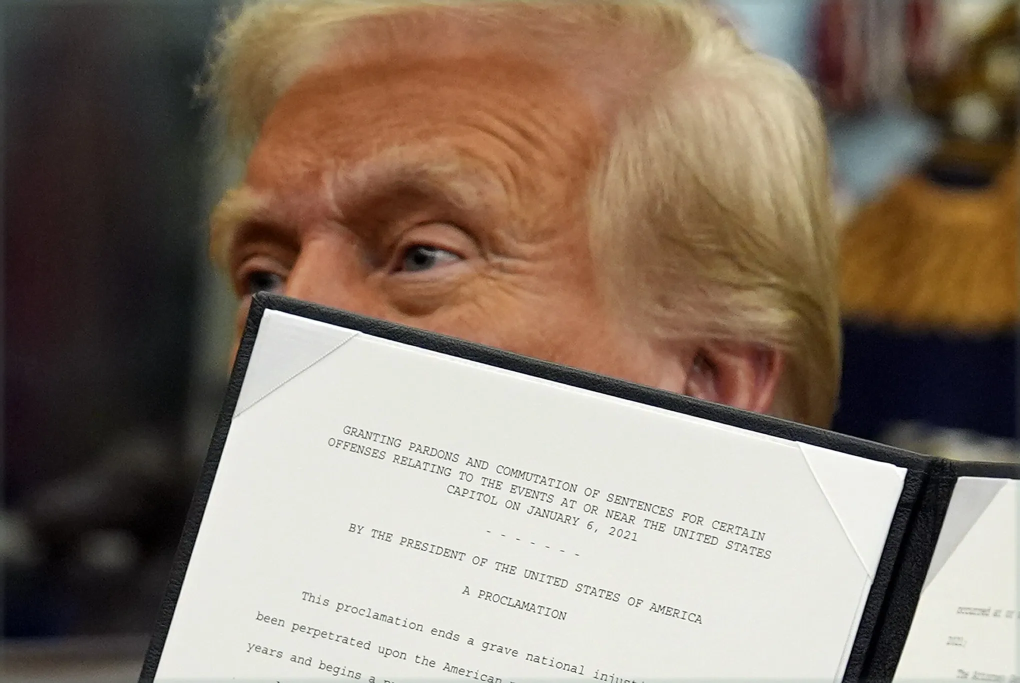 President Trump presenting signed Jan 6 pardons