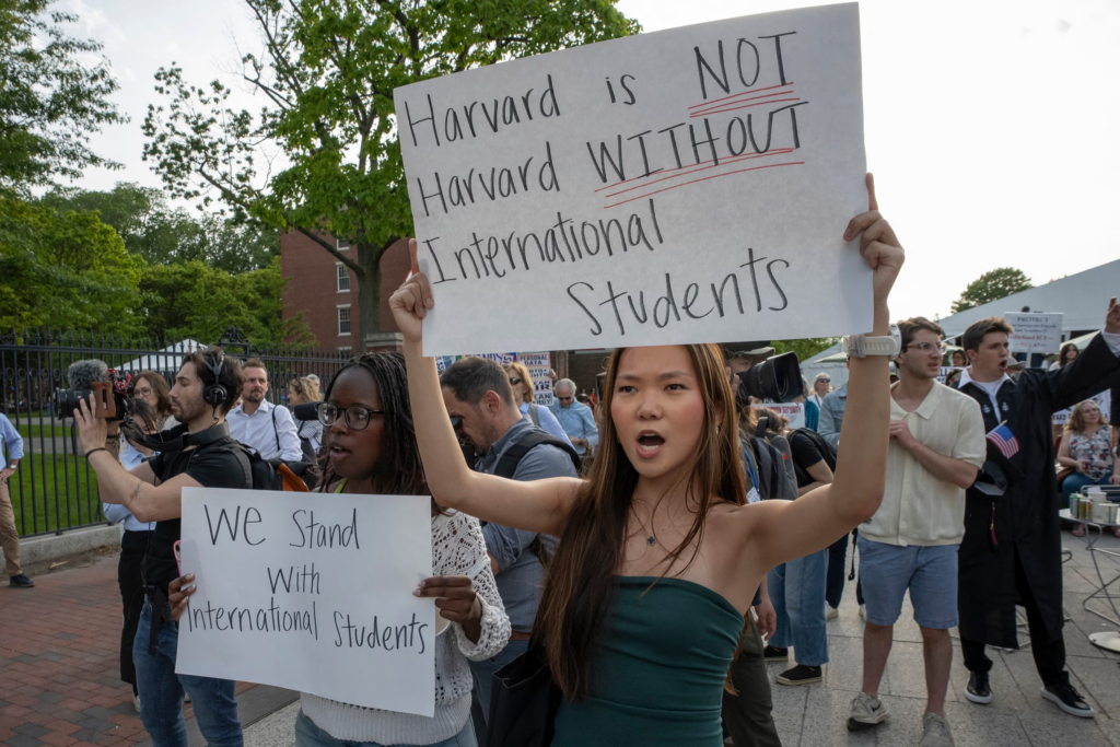 protesters demonstrating in support of international harvard students