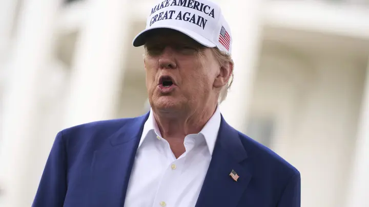 President Donald Trump talks with reporters before a flag pole is installed on the South Lawn of the White House, June 18, 2025, in Washington. (Evan Vucci/The Associated Press) 