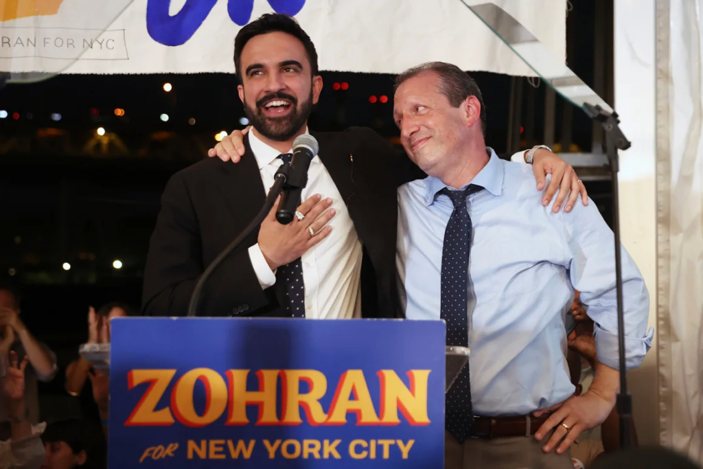 Zohran Mamdani, left, speaks on stage with fellow candidate Comptroller Brad Lander. Heather Khalifa/AP