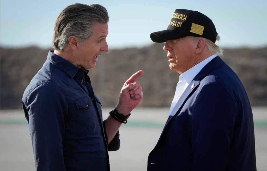 President Donald Trump listens to Gov. Gavin Newsom after arriving on Air Force One at LAX on Jan. 24, 2025.
(Mark Schiefelbein/AP Photo)