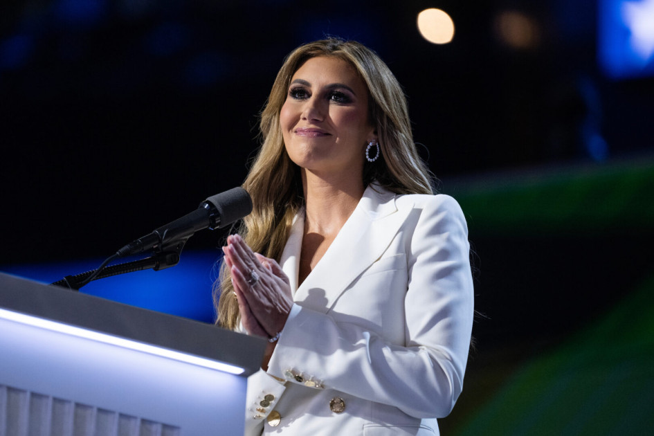 Alina Habba speaking at a podium