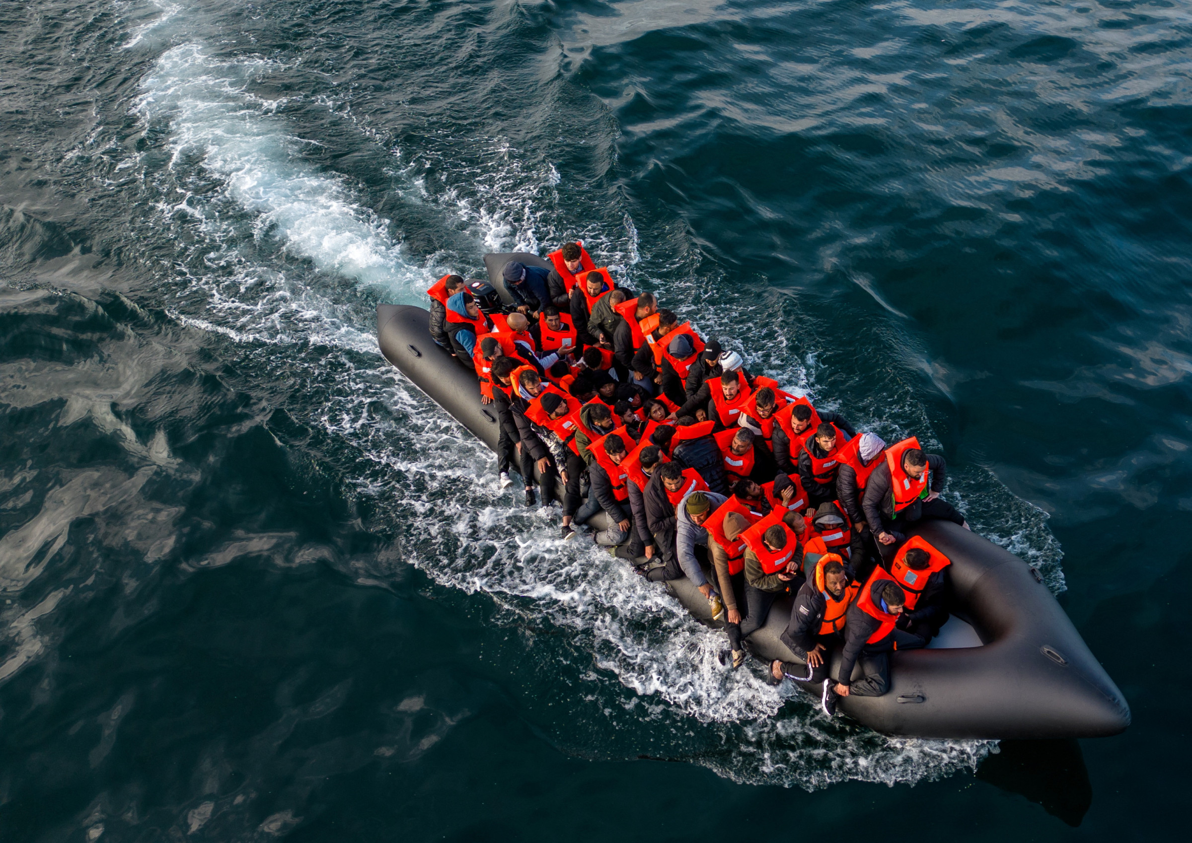 Migrants crossing the English Channel in a small boat