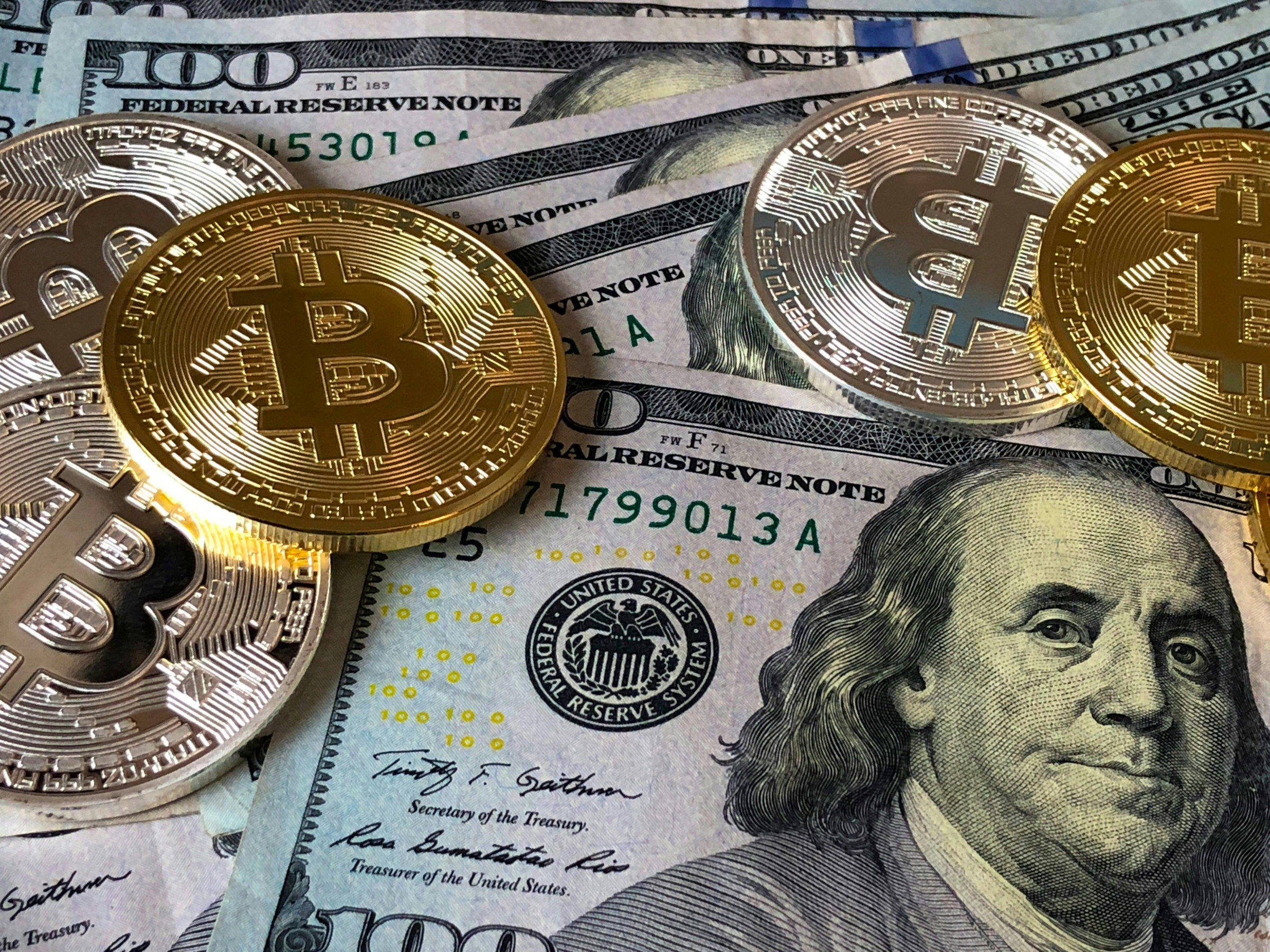 Bitcoin and US Dollar bills