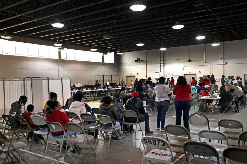 a crowded immigration court waiting room