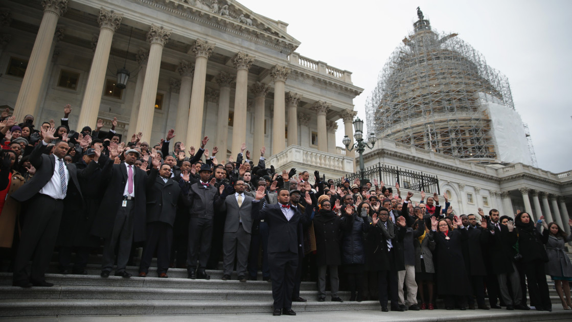 U.S. Capitol building with members of Congress walking outside