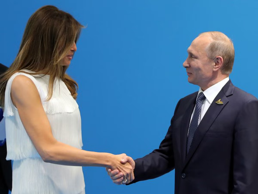 melania trump and vladimir putin shaking hands