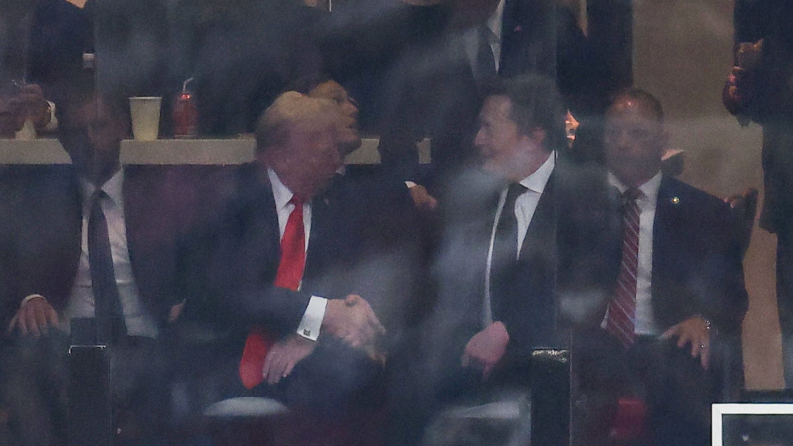 Donald Trump and Elon Musk shaking hands at kirk memorial