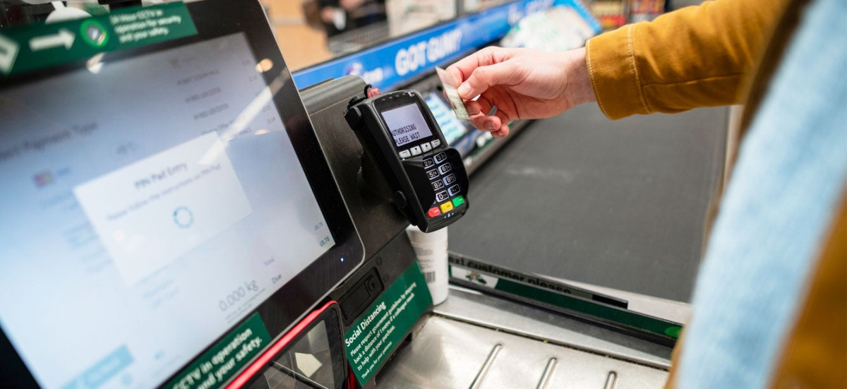 grocery store checkout showing EBT card transaction