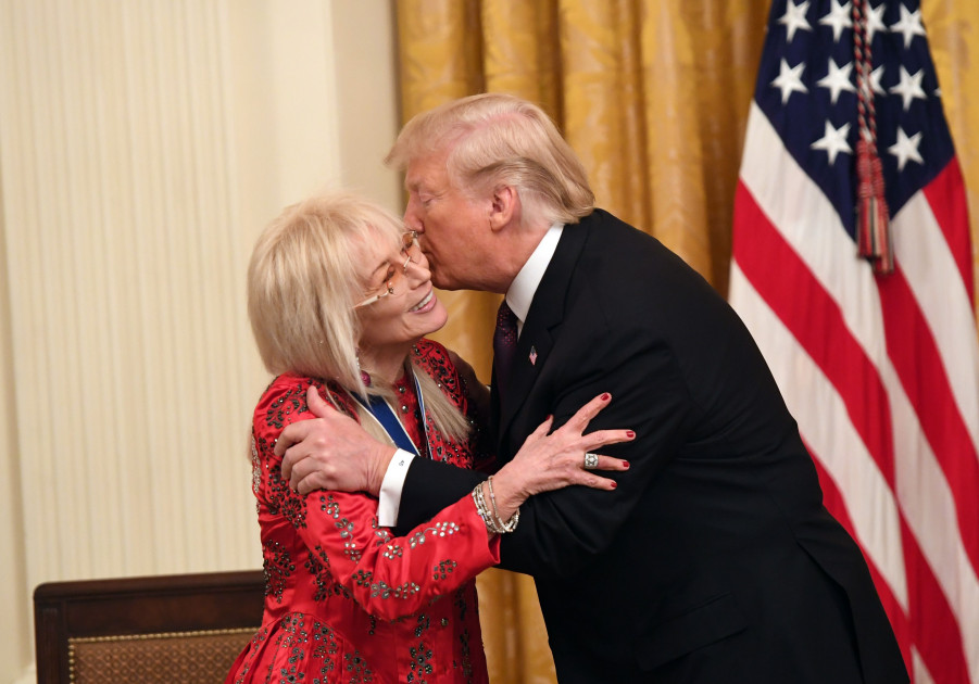 Miriam Adelson receiving medal