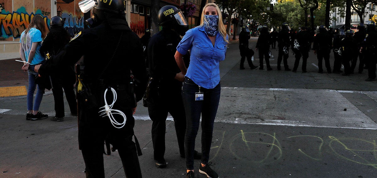 journalist covering street protest scene