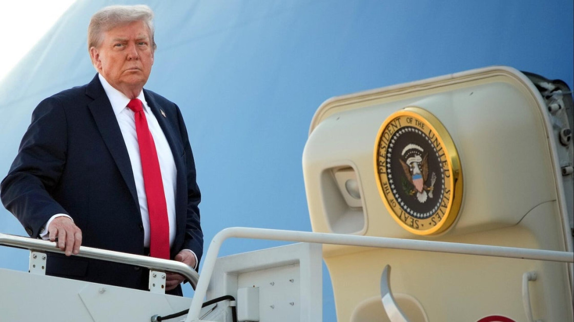 President Donald Trump speaking aboard Air Force One
