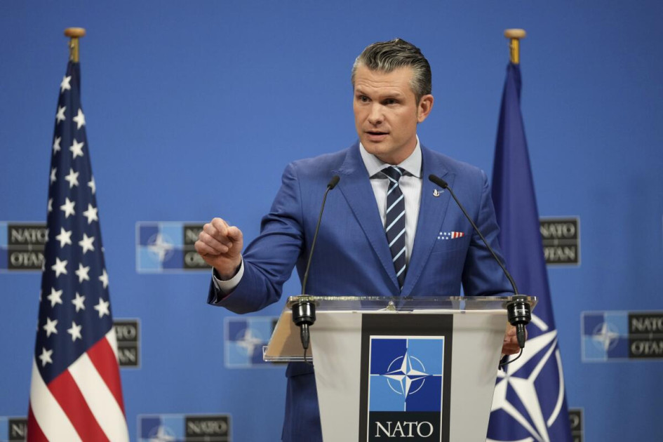 Pete Hegseth at Pentagon podium