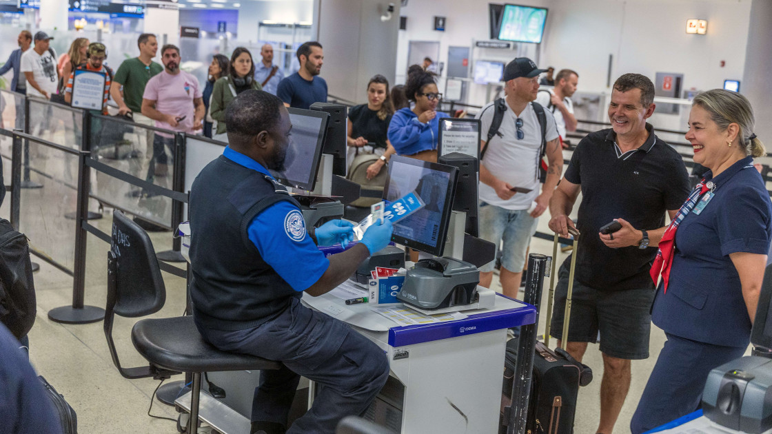 TSA agents at airport security checkpoint